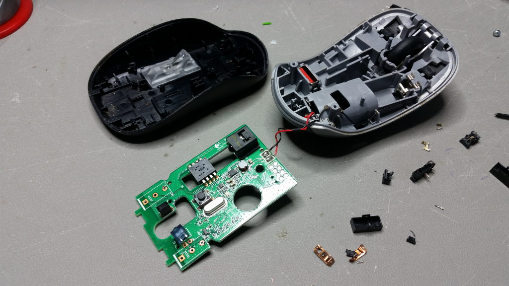 The second mouse disassembled with the left and right click switches removed